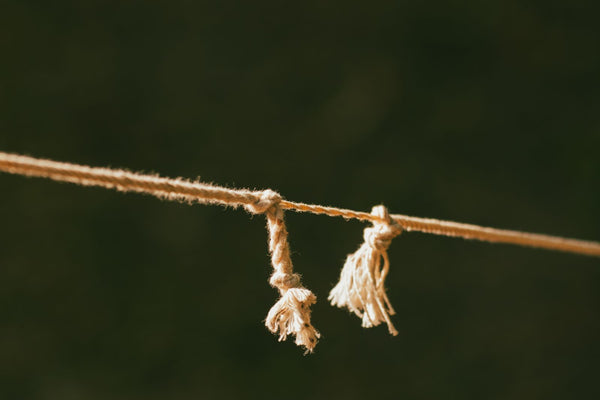 Close-up of a frayed rope showing the strands inside