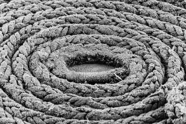 Close-up macro photo of tightly coiled climbing rope