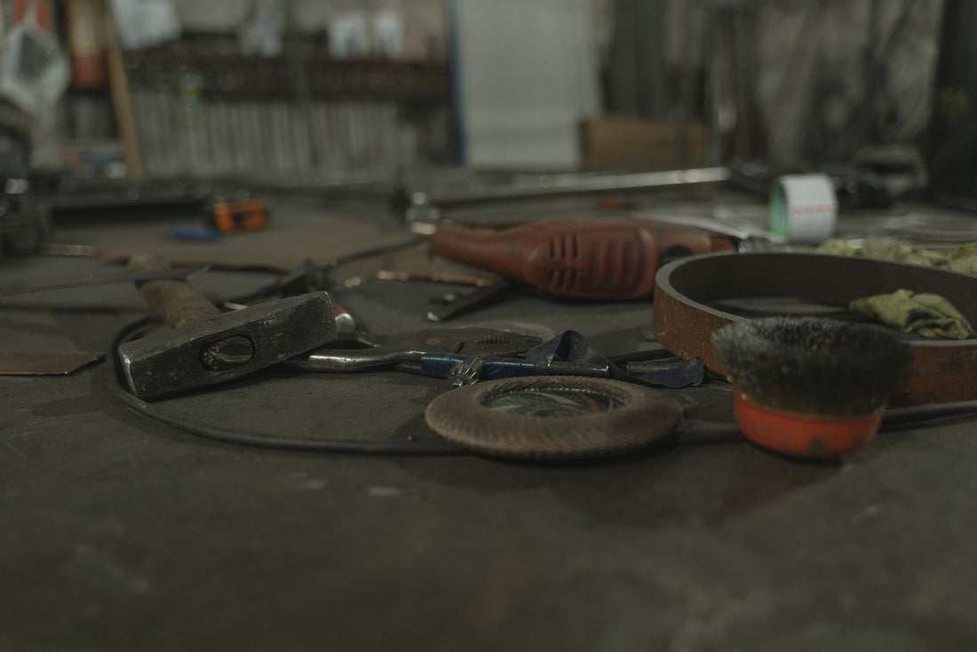 Tools scattered across a busy workshop workbench