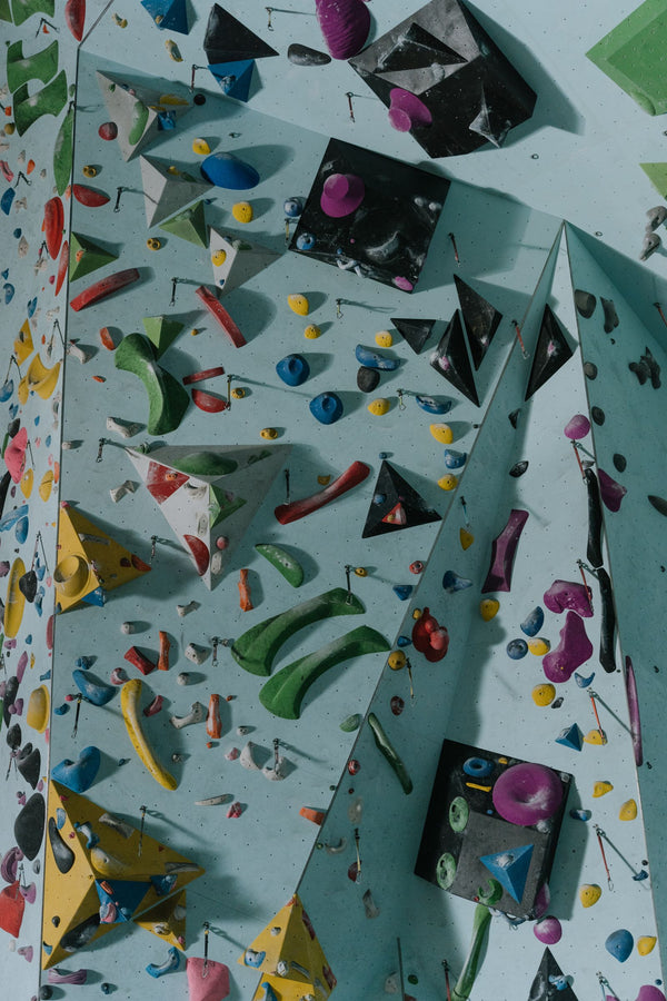Climber on an indoor climbing wall in a bouldering gym